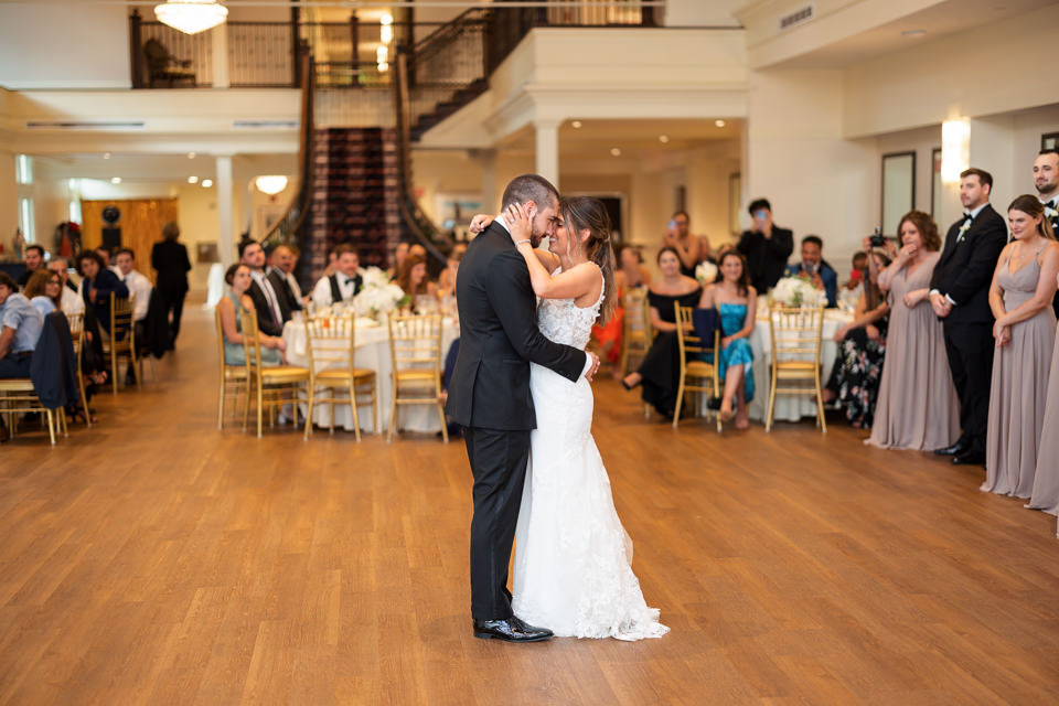A couple shares their first dance in the Riverview Room at Saint Clements Castle in Portland, CT.